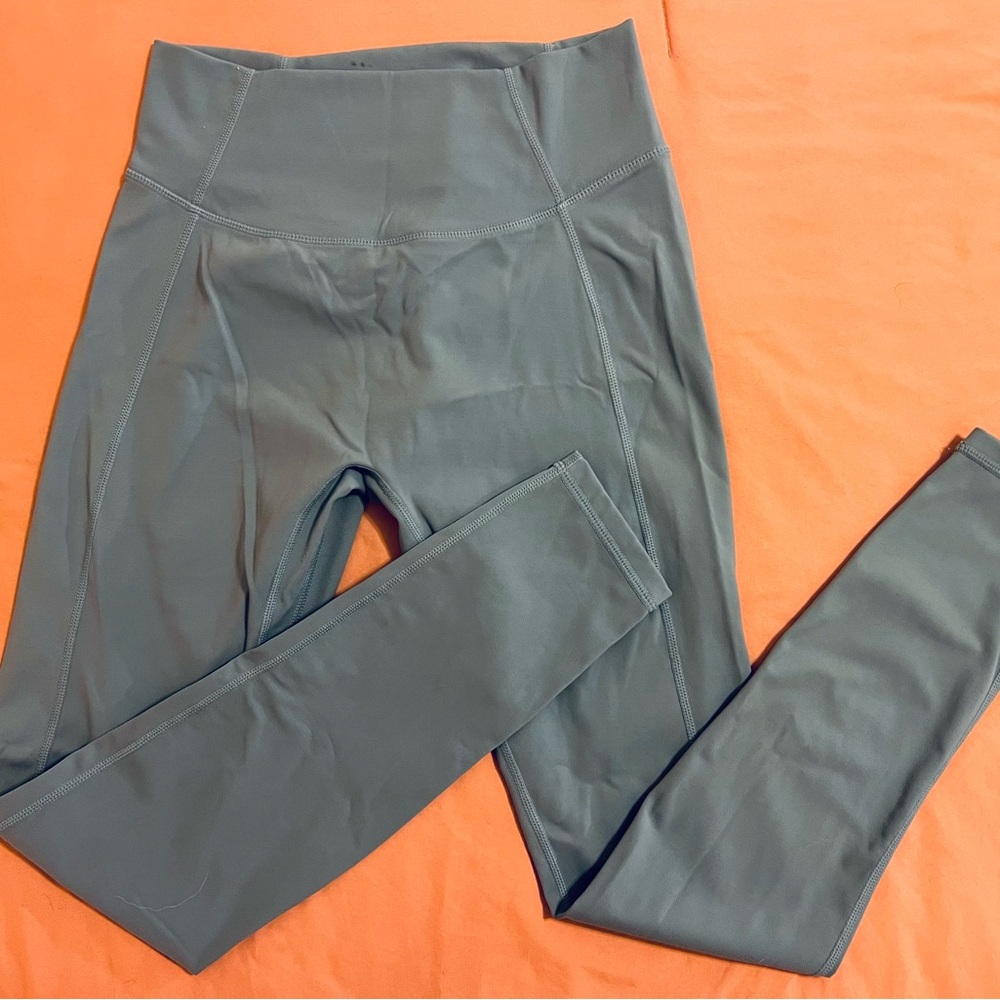 Blue leggings. Size L. Tlf.